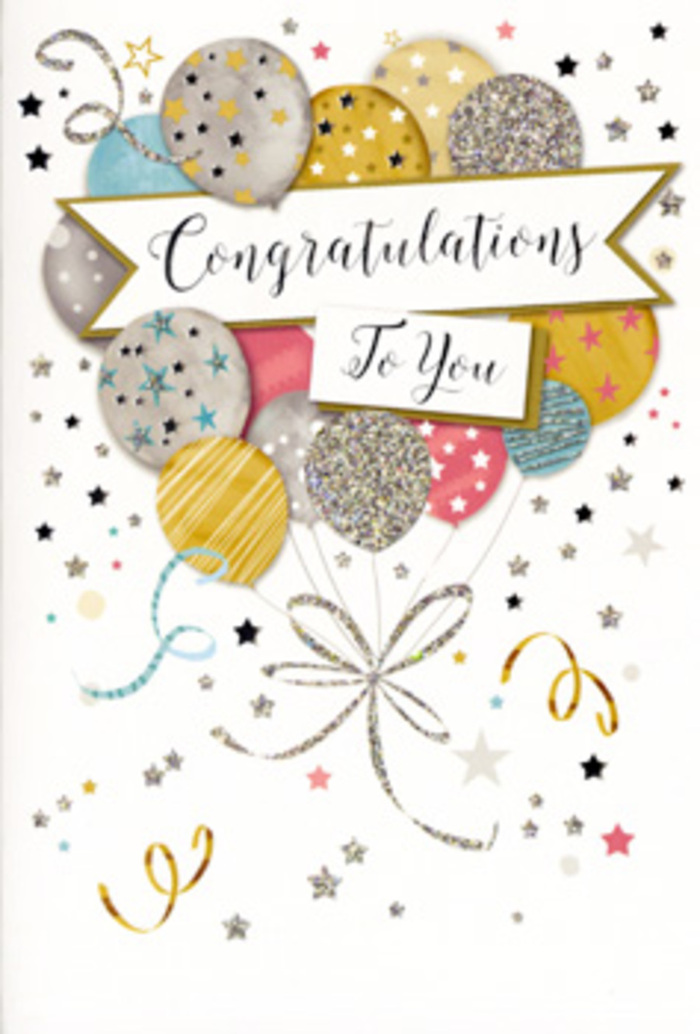 In the photograph, a sophisticated congratulations card is displayed upright, its design capturing that polished yet joyful spirit you often feel walking through Holborn after a day of big news. The front is dominated by a generous spray of rounded balloons, each rendered in soft metallic tones of gold, silver, champagne, sky blue, blush pink, and muted grey. They overlap in a gentle cascade, creating an impression of fullness without feeling crowded, like a well-balanced floral arrangement. Each balloon carries subtle decoration-some with glitter-dusted stripes, others with clusters of miniature stars, and a few with fine, shimmering speckles-so the eye moves naturally around the composition. A broad banner sweeps through the centre, holding the words "Congratulations To You" in flowing, ornate script that feels both celebratory and heartfelt, as though penned especially for one deserving person. Around this focal point, light curls of ribbon twist and trail, while tiny gold and silver stars, dots, and swirls float across the pale, neutral background like confetti drifting down in slow motion. The card stock appears to be of high quality, perhaps with a soft matte finish and raised glitter accents you could sense under your fingertips. The mood is warm, proud, and polished-perfect for recognising milestones such as promotions in nearby offices, qualifications gained through long study, or new ventures launched from an address around Chancery Lane. To a florist in Holborn, this card naturally pairs with an elegant bouquet, ready to be delivered across WC1 and WC2 as a complete expression of congratulations.